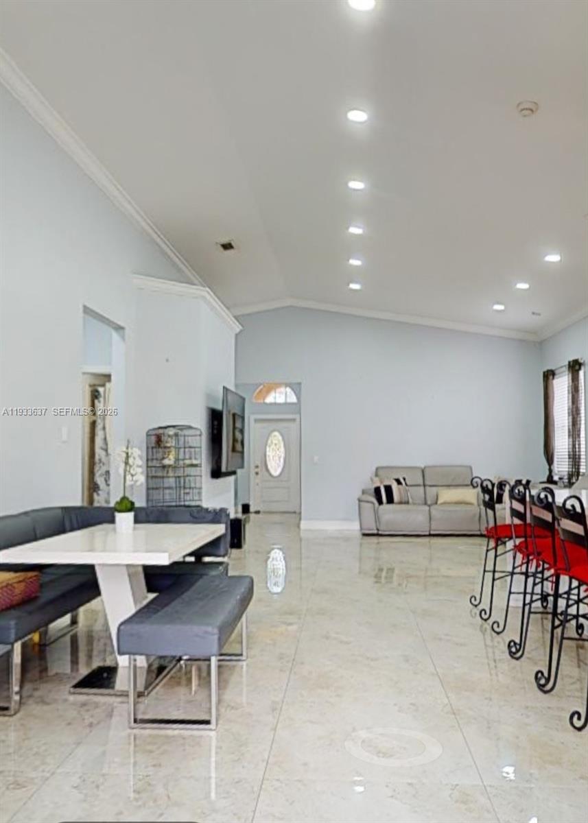 13877 Southwest 50th Street Miramar, FL 33027 - Photo 25 of 54 a living room with furniture and a table