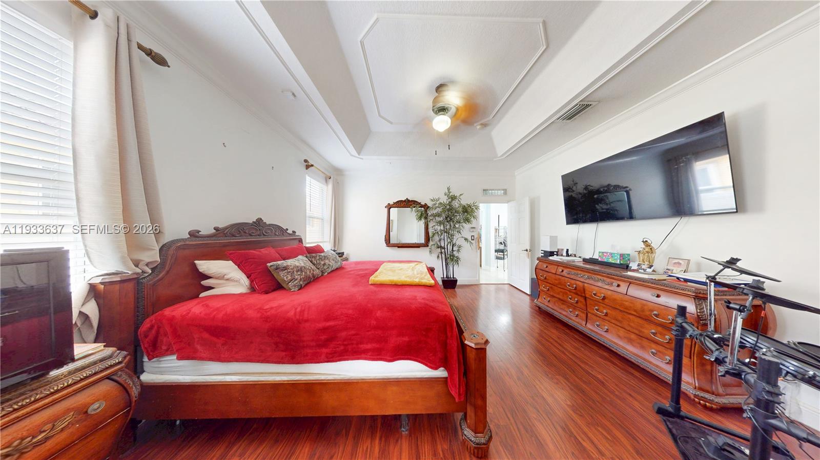 13877 Southwest 50th Street Miramar, FL 33027 - Photo 28 of 54 a bedroom with two beds and a flat screen tv