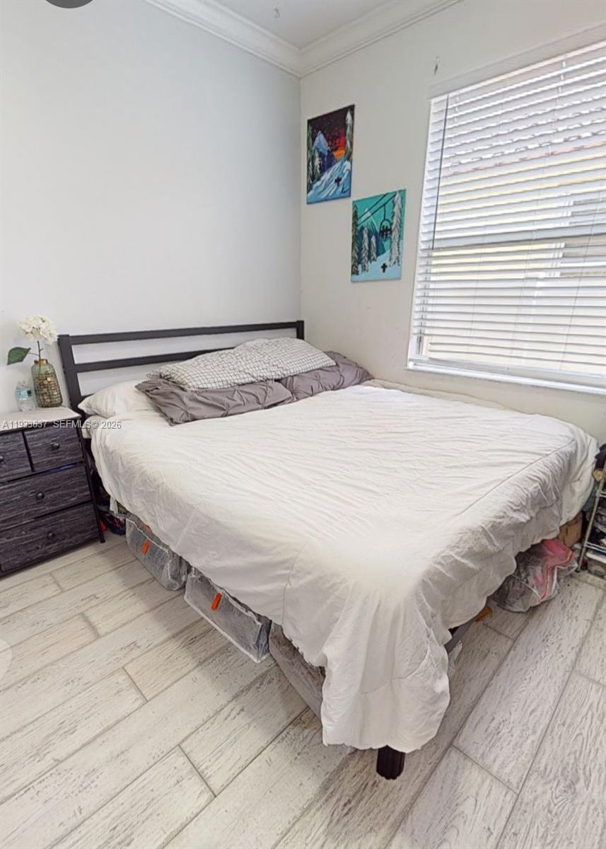 13877 Southwest 50th Street Miramar, FL 33027 - Photo 35 of 54 a bedroom with a bed and a window