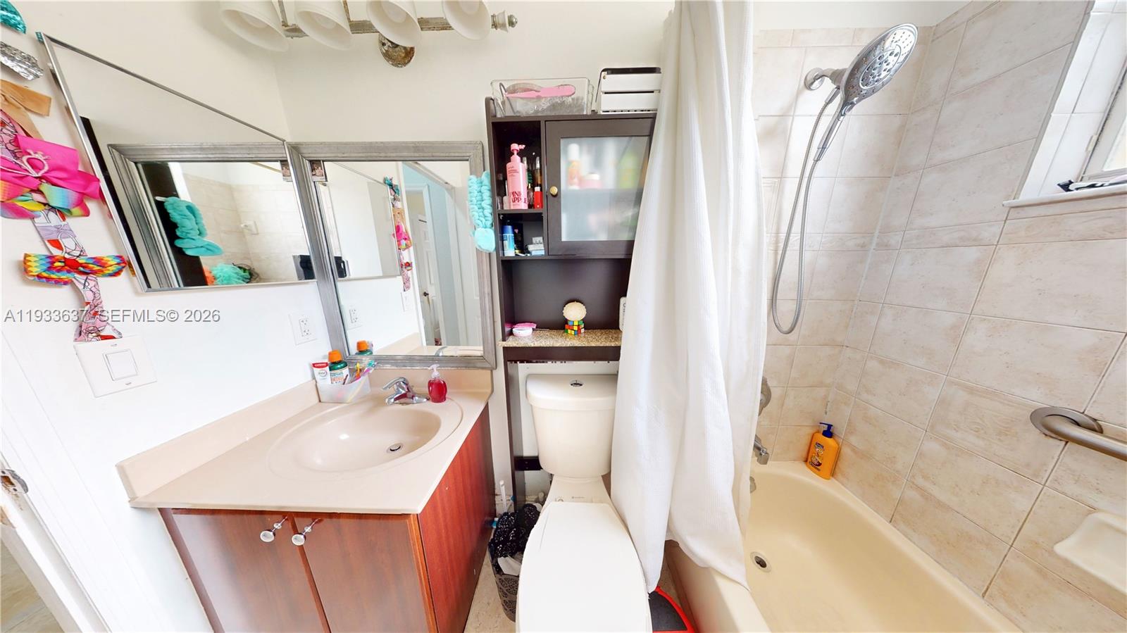 13877 Southwest 50th Street Miramar, FL 33027 - Photo 39 of 54 a bathroom with a sink vanity tub and a shower