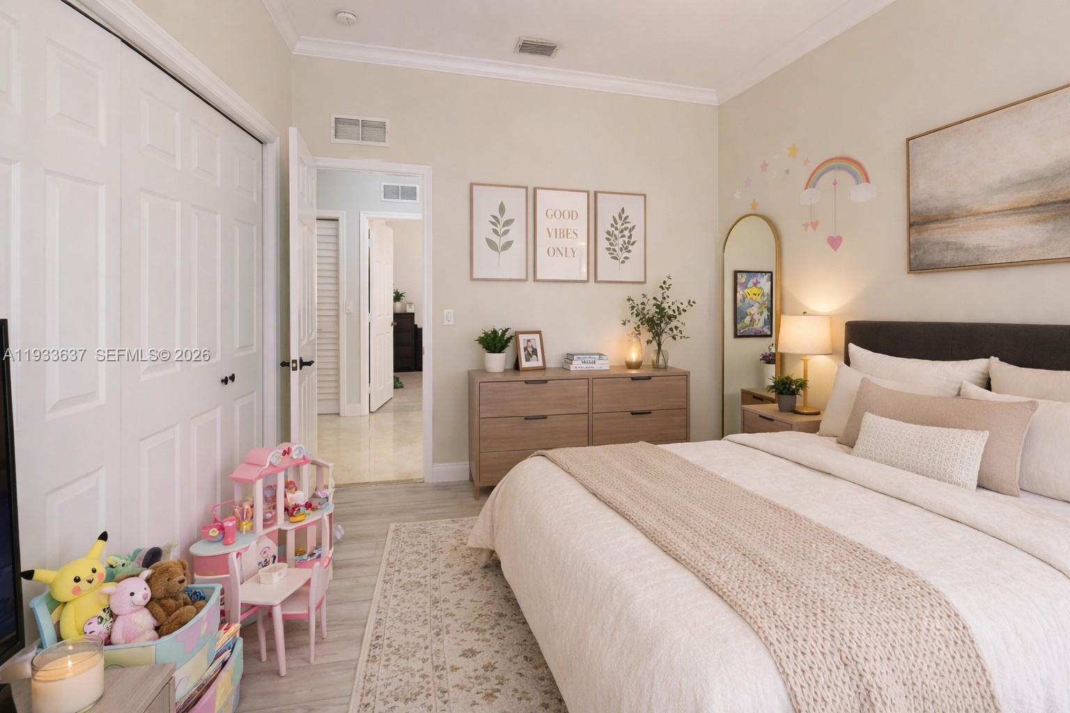 13877 Southwest 50th Street Miramar, FL 33027 - Photo 43 of 54 a bedroom with a bed and a chandelier