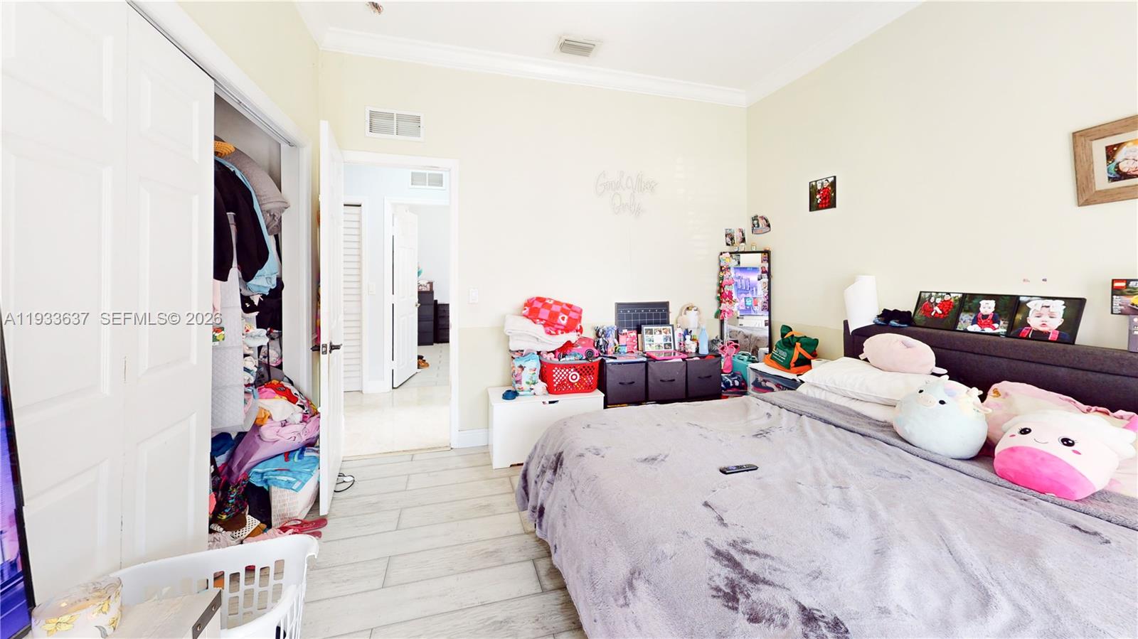 13877 Southwest 50th Street Miramar, FL 33027 - Photo 45 of 54 a bedroom with bed and glass door