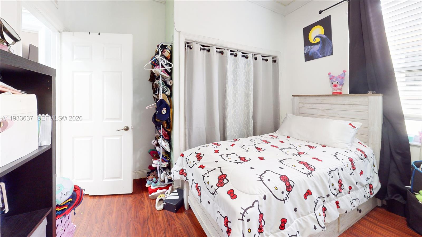 13877 Southwest 50th Street Miramar, FL 33027 - Photo 48 of 54 a bedroom with a bed and a window