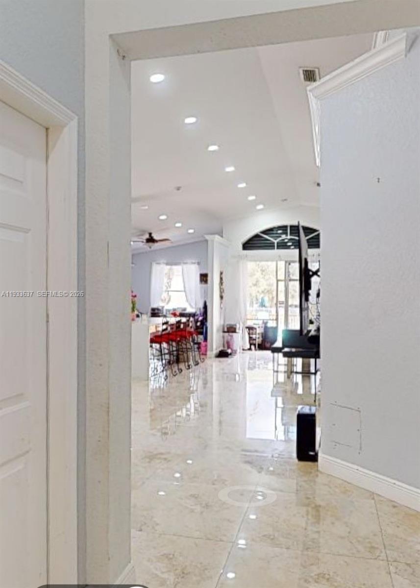 13877 Southwest 50th Street Miramar, FL 33027 - Photo 5 of 25 a kitchen with sink and view of living room