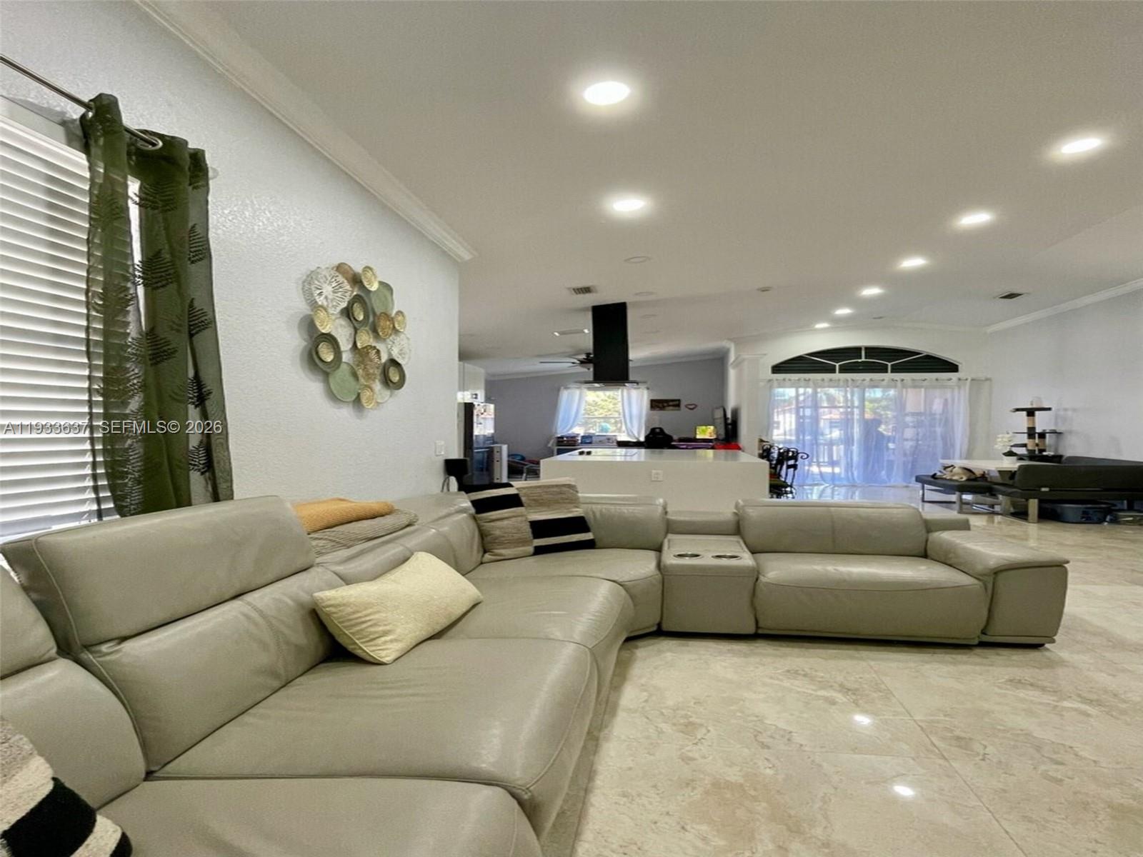 13877 Southwest 50th Street Miramar, FL 33027 - Photo 7 of 25 a living room with furniture and a large window