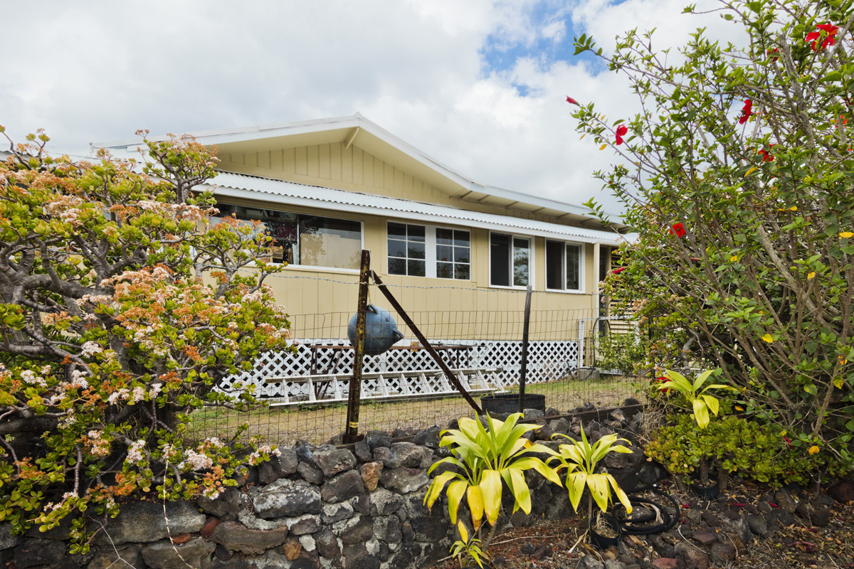 92-1663 Keaka Parkway Ocean View, HI 96704 - Photo 6 of 30 a view of a house with a flower garden