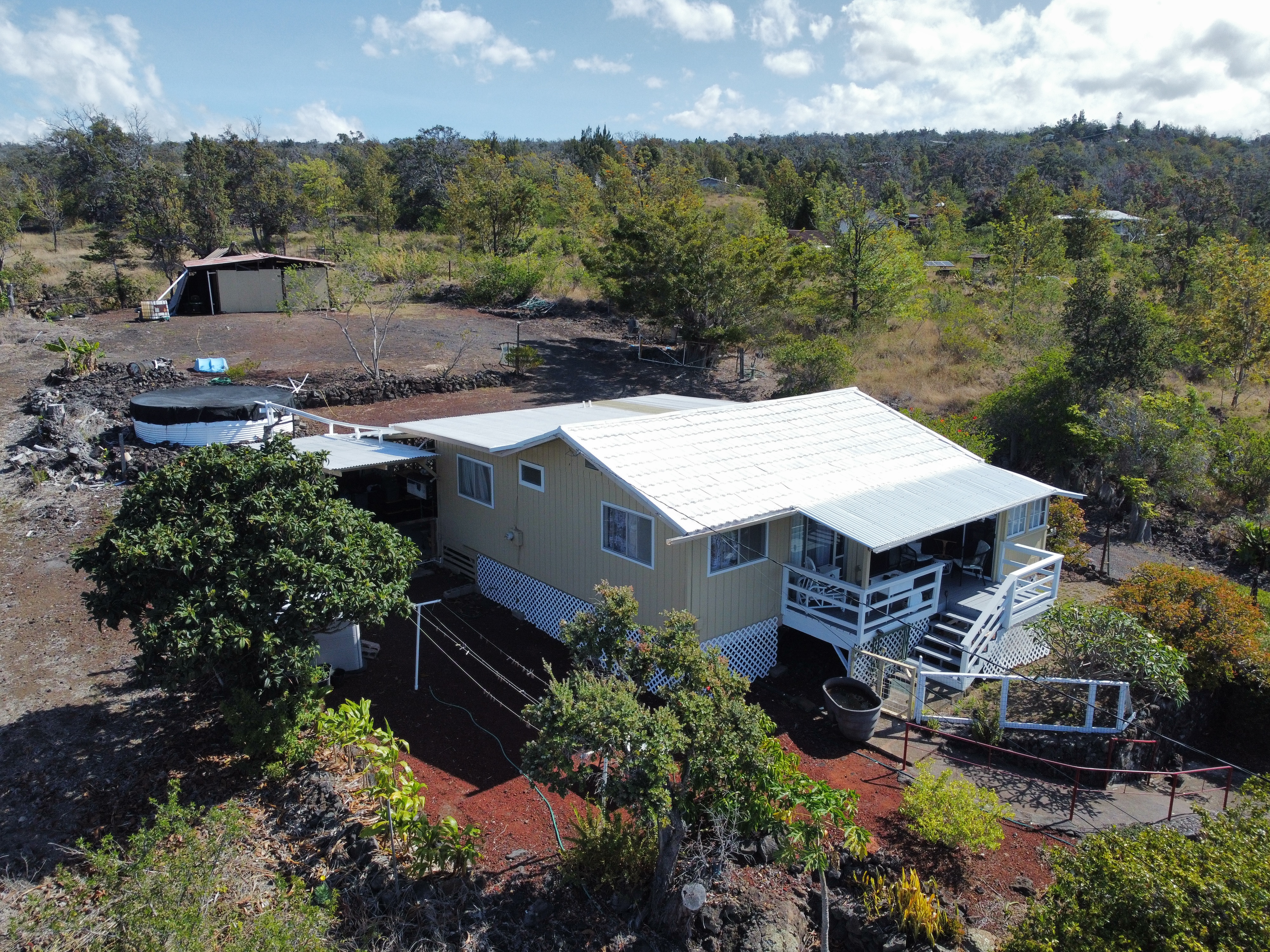 92-1663 Keaka Parkway Ocean View, HI 96704 - Photo 10 of 30 an aerial view of a house with a garden