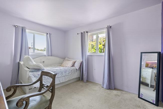 2056 Trinity Street San Mateo, CA 94403 - Photo 14 of 42 a bedroom with a bed and a mirror