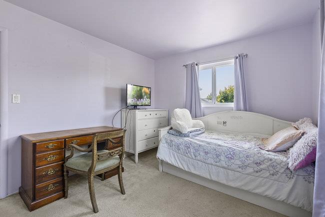 2056 Trinity Street San Mateo, CA 94403 - Photo 15 of 42 a bedroom with a bed and a desk