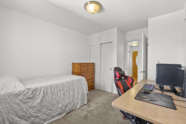 2056 Trinity Street San Mateo, CA 94403 - Photo 21 of 42 a bedroom with bed and a desk