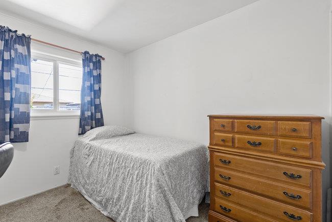 2056 Trinity Street San Mateo, CA 94403 - Photo 22 of 42 a bedroom with a bed and a dresser