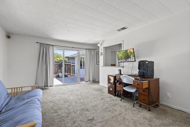 2056 Trinity Street San Mateo, CA 94403 - Photo 24 of 42 a view of a workspace with furniture and a window