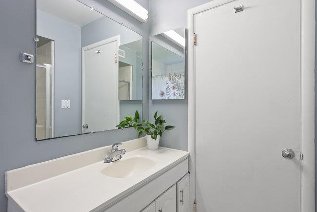 2056 Trinity Street San Mateo, CA 94403 - Photo 27 of 42 a bathroom with a sink and a mirror