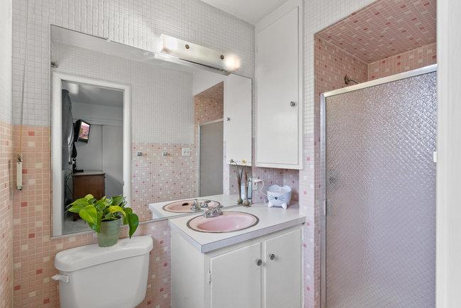 2056 Trinity Street San Mateo, CA 94403 - Photo 28 of 42 a bathroom with a sink toilet and shower