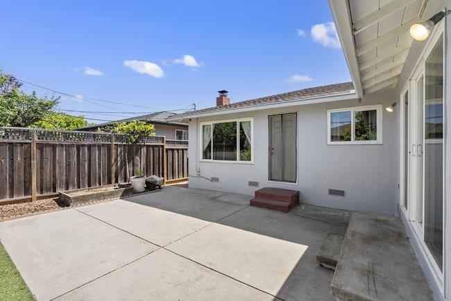 2056 Trinity Street San Mateo, CA 94403 - Photo 31 of 42 a backyard of a house with table and chairs