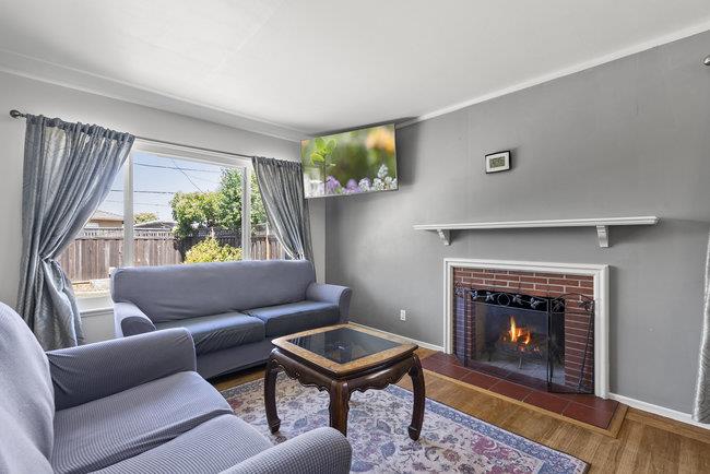 2056 Trinity Street San Mateo, CA 94403 - Photo 5 of 42 a living room with furniture and a fireplace