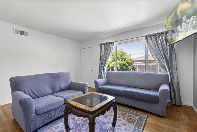 2056 Trinity Street San Mateo, CA 94403 - Photo 7 of 42 a living room with furniture and a window