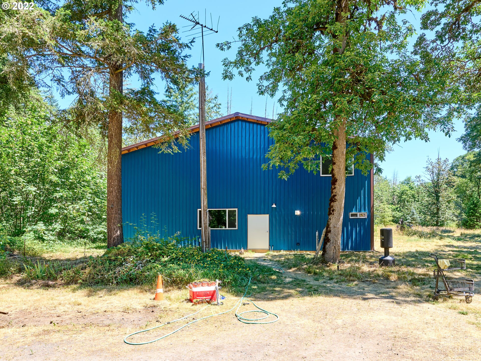 29920 South Dhooghe Road Colton, OR 97017 - Photo 5 of 32 a house that has a tree in front of it