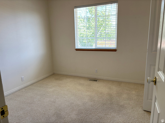 798 South 600 East Payson, UT 84651 - Photo 19 of 31 Carpeted room with a window featuring white blinds and wood trim