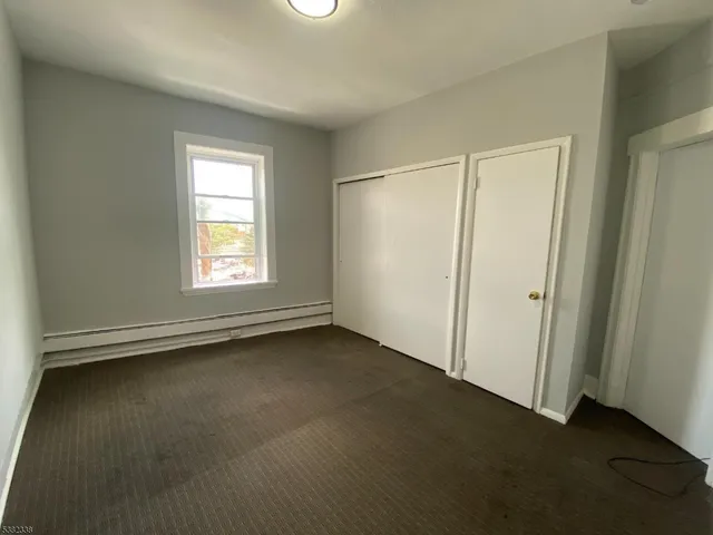 a white bath tub sitting next to a white sink and vanity