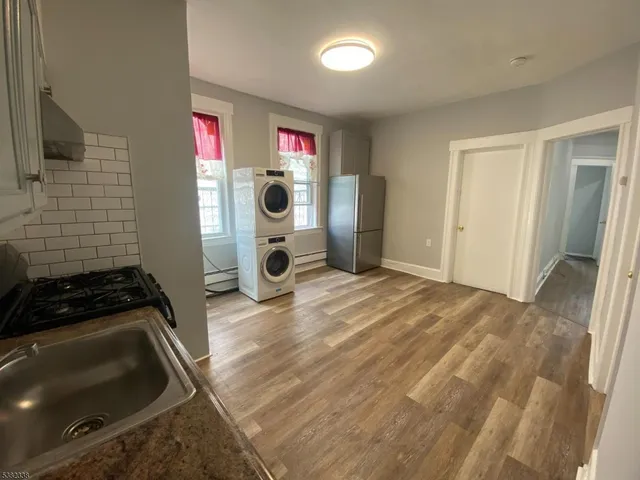 a bedroom with a bed and cabinets