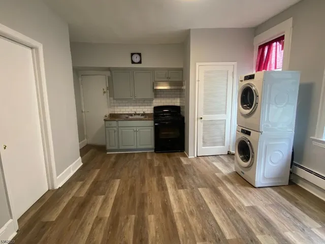 a kitchen with a refrigerator and washer