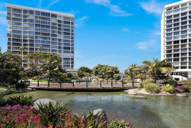 a view of a big room with lots of dining room furniture and wooden floor