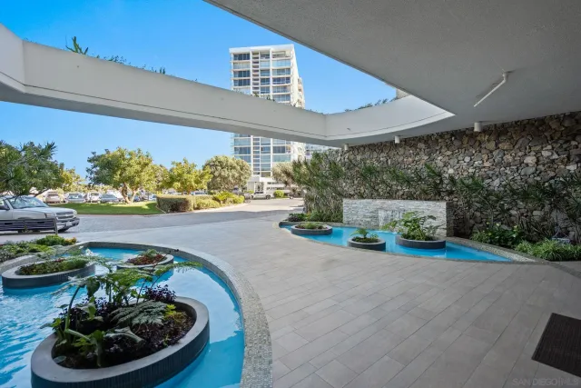 a view of a swimming pool with outdoor seating
