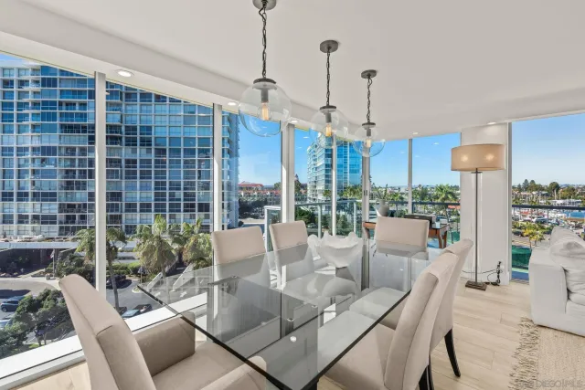 a view of a dining room with furniture wooden floor and chandelier