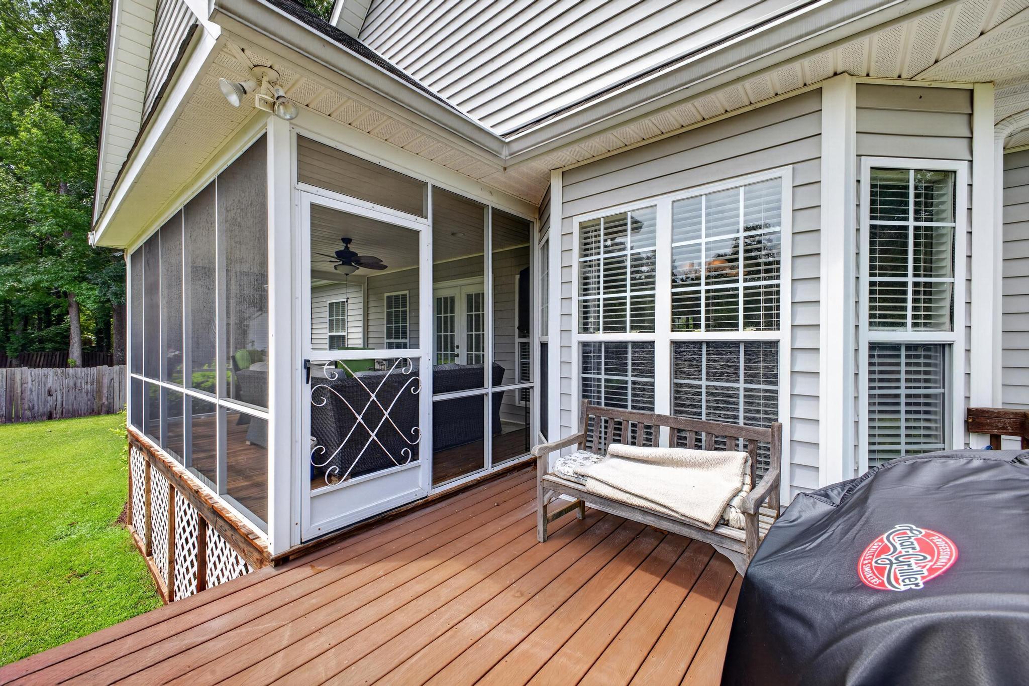 42 Emerald Ridge Aiken, SC 29803 - Photo 25 of 33 a view of a chairs and table on the wooden deck