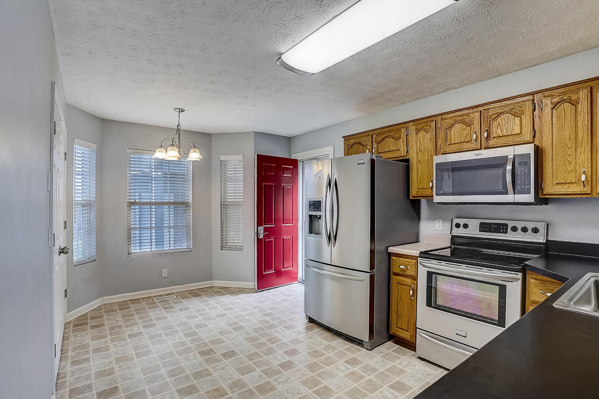 106 Vanatta Road Portland, TN 37148 - Photo 11 of 31 a kitchen with stainless steel appliances granite countertop a refrigerator stove and sink