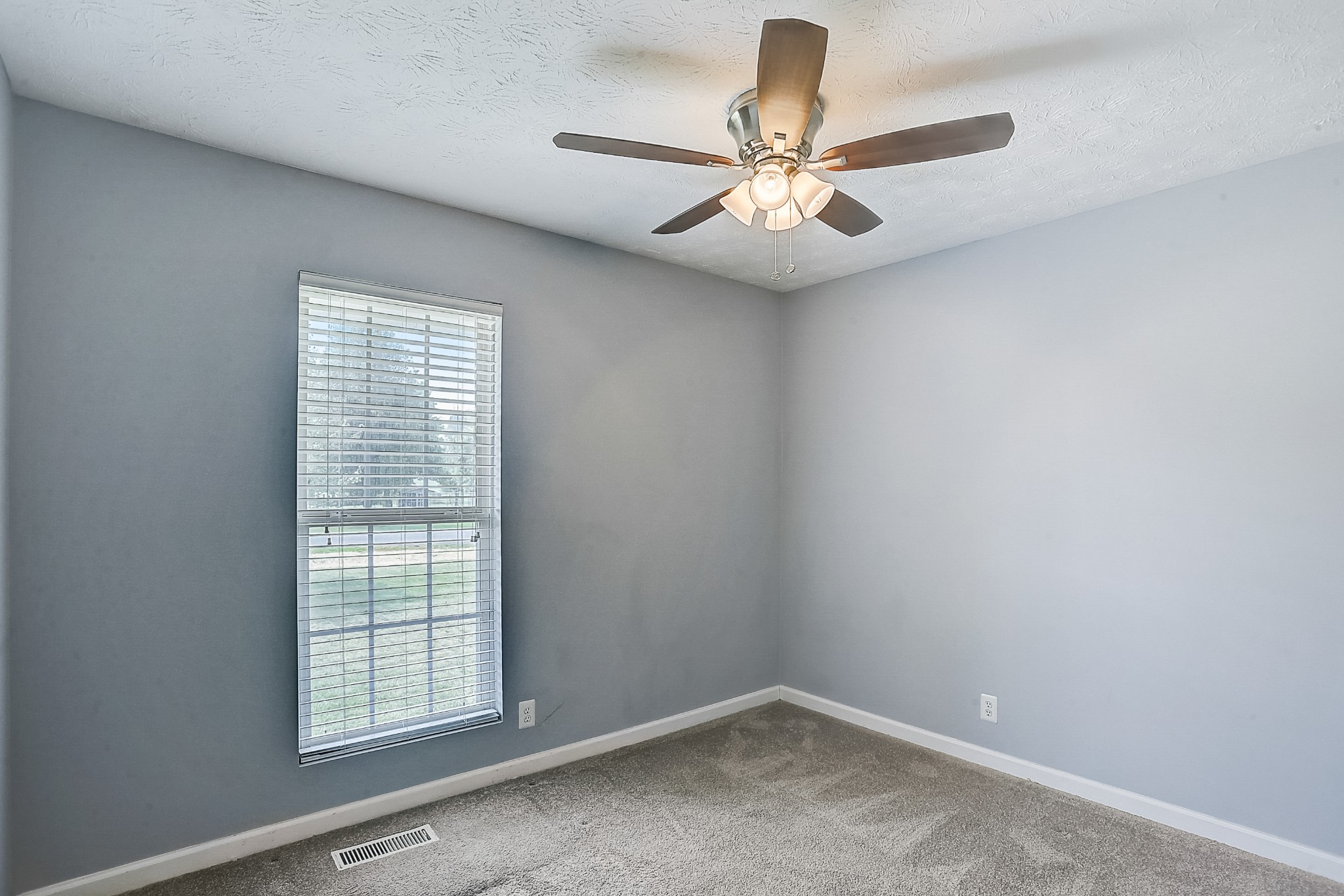 106 Vanatta Road Portland, TN 37148 - Photo 15 of 31 an empty room with windows and fan