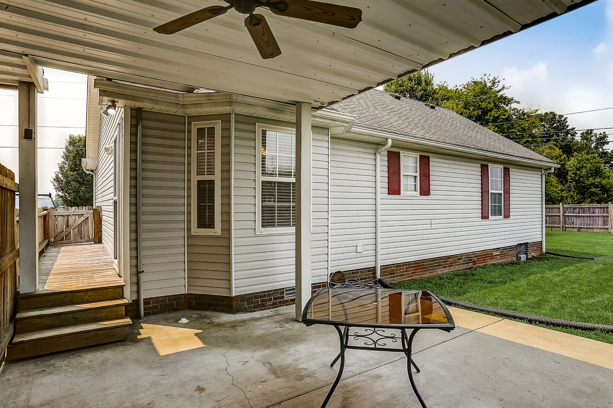 106 Vanatta Road Portland, TN 37148 - Photo 27 of 31 a view of a patio with a table and chairs and a barbeque