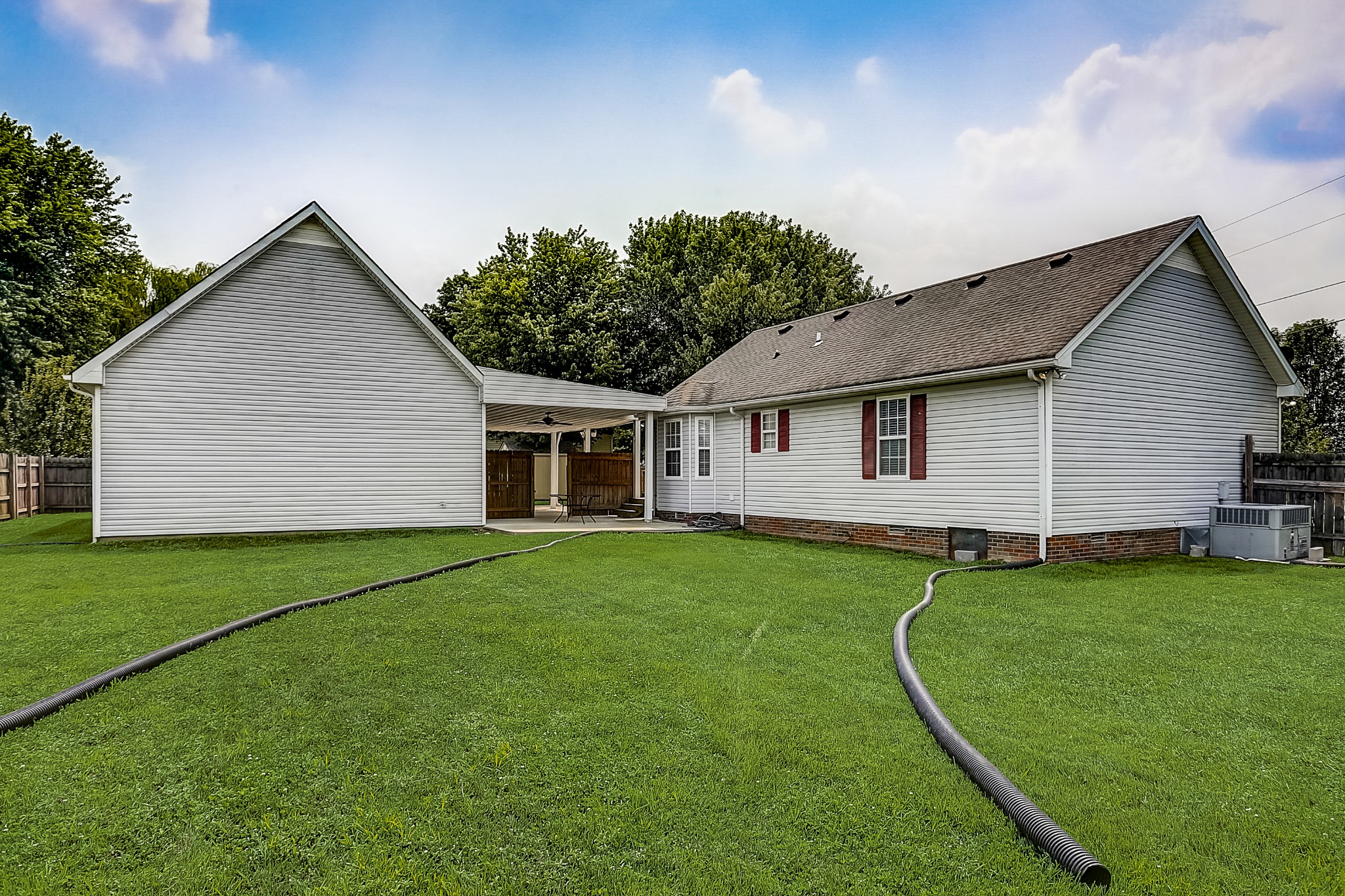 106 Vanatta Road Portland, TN 37148 - Photo 30 of 31 a view of a backyard with plants and a garden