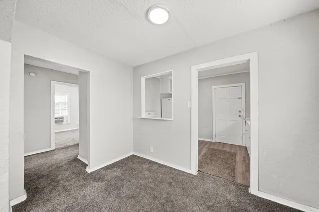 a view of an empty room and closet area