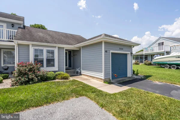 an aerial view of a house with a ocean view