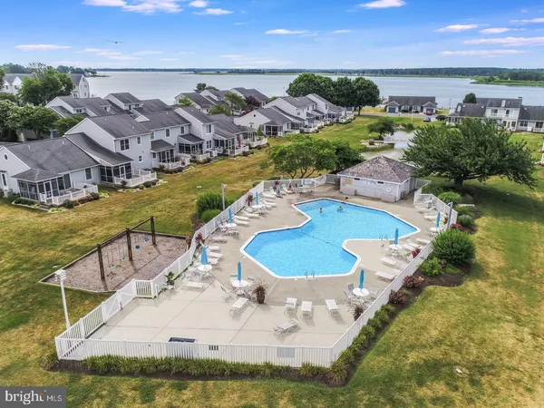an aerial view of residential houses with outdoor space