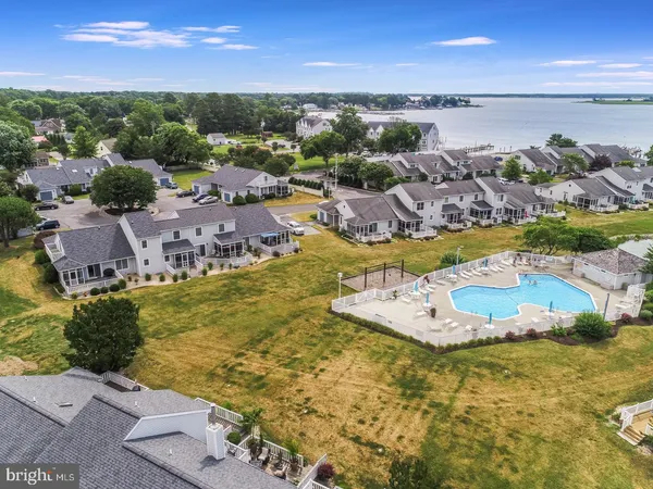 an aerial view of a house with a lake view