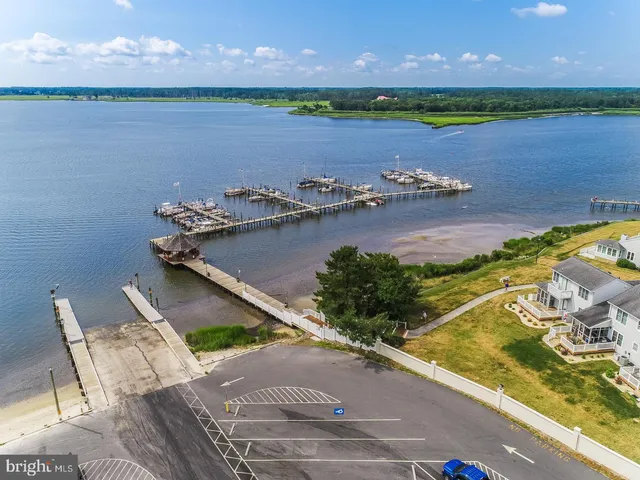 an aerial view of a houses with a lake view