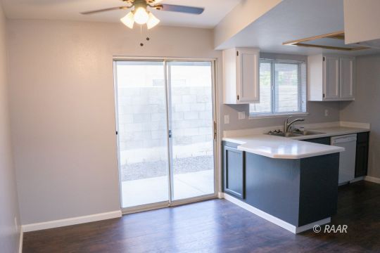 148 South Lilac Street Ridgecrest, CA 93555 - Photo 10 of 34 a kitchen with a refrigerator and a sink