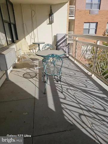 a view of a patio with table and chairs