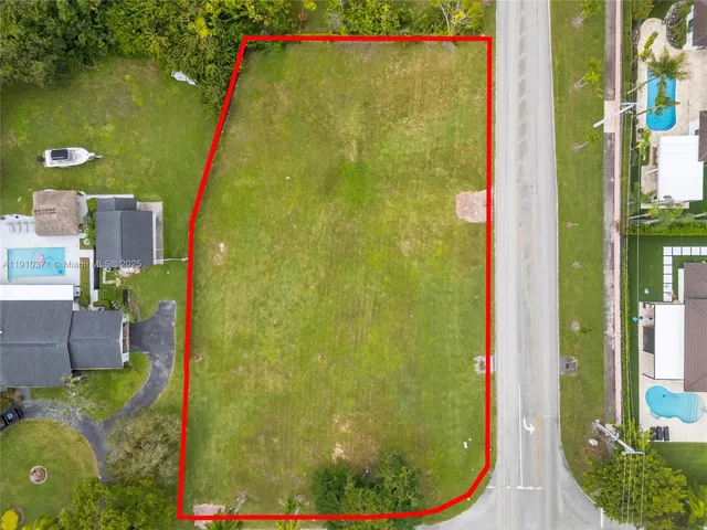 a view of a swimming pool with an outdoor seating
