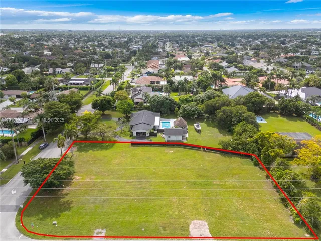 a view of a swimming pool with a yard