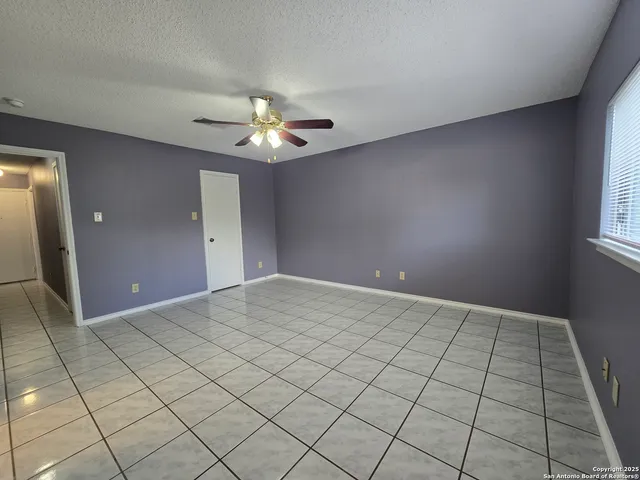 a view of an empty room and window