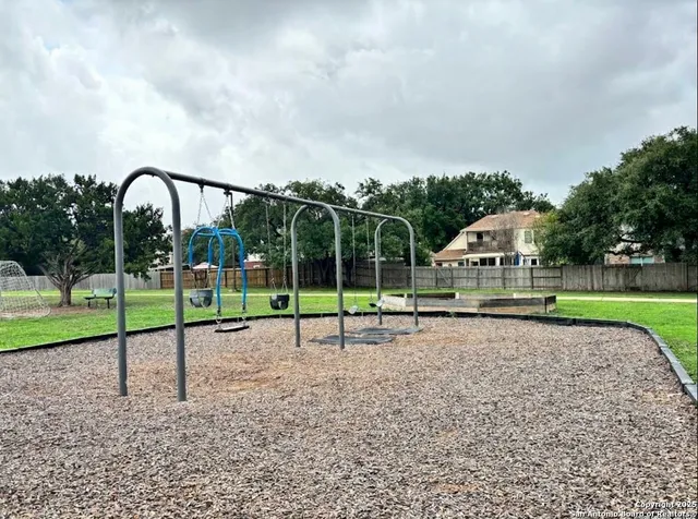 a view of a house with a backyard and a garden