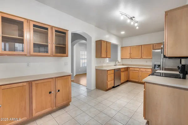 a kitchen with cabinets a sink and appliances