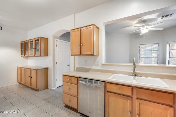 a kitchen with a sink and cabinets