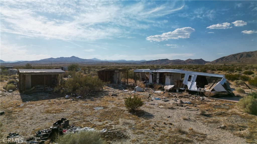10313 Lake Road Cantil, CA 93519 - Photo 17 of 31 a view of a house with yard and furniture