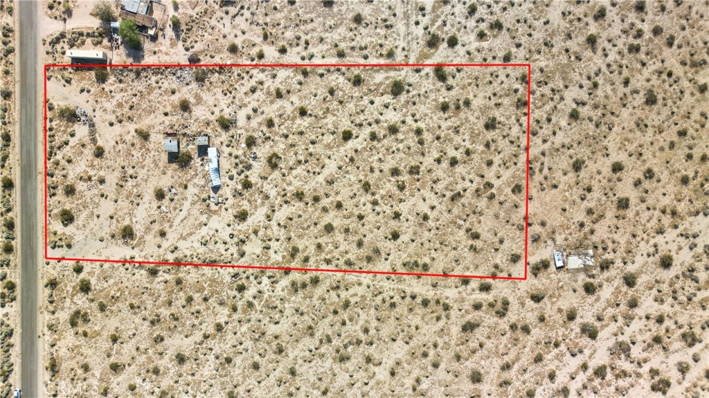 10313 Lake Road Cantil, CA 93519 - Photo 24 of 31 a bathroom with a shower curtain