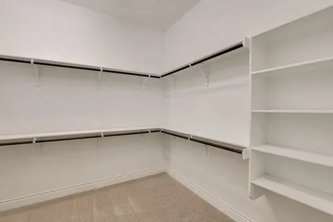 a view of an empty walk in closet
